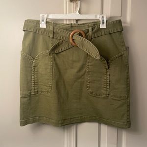 Green belted denim mini skirt